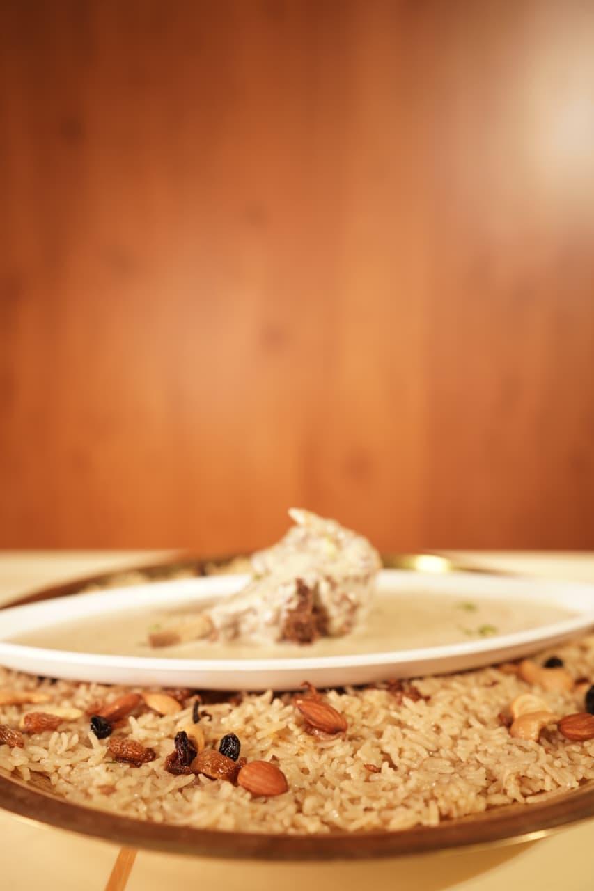 Mutton in a creamy gravy served over mandi rice with dry fruits