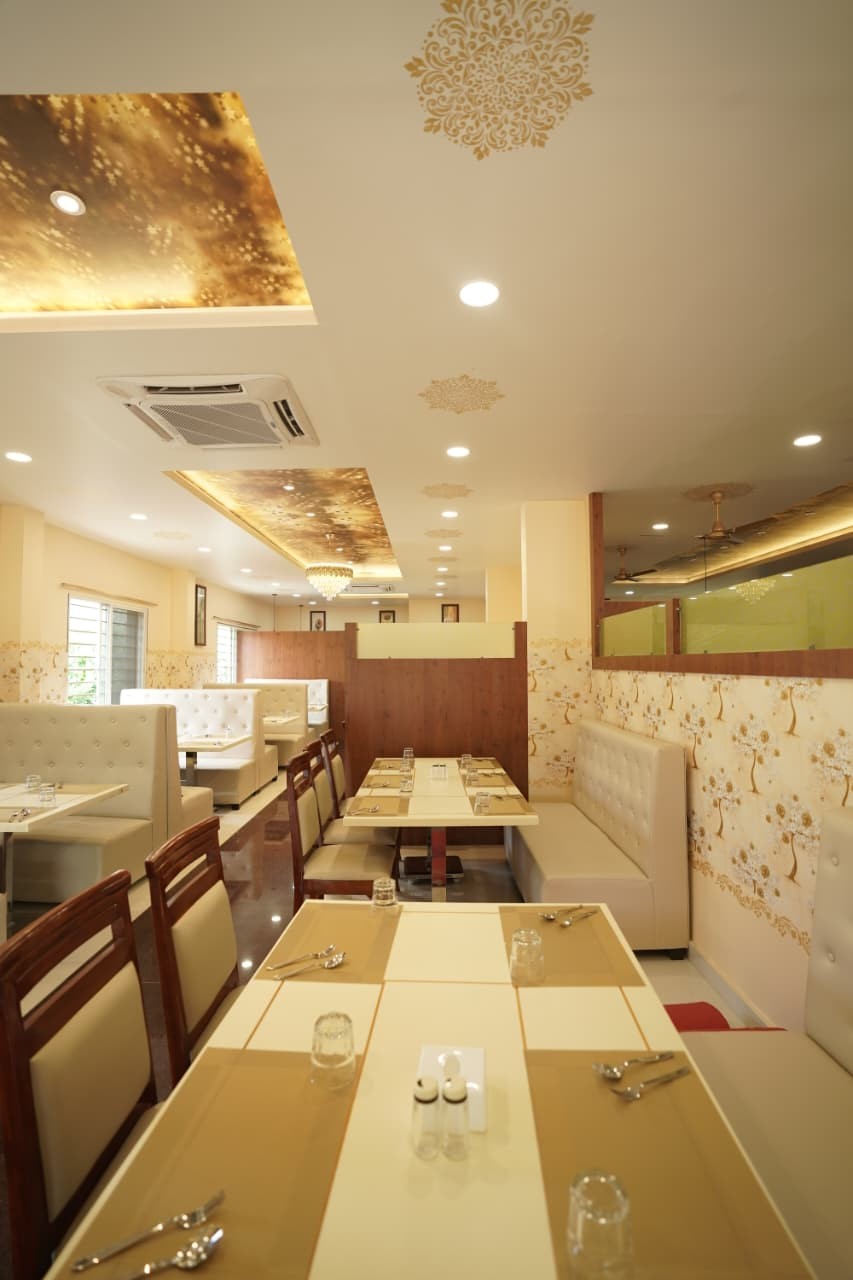 Dining hall with ivory booths and walnut chairs