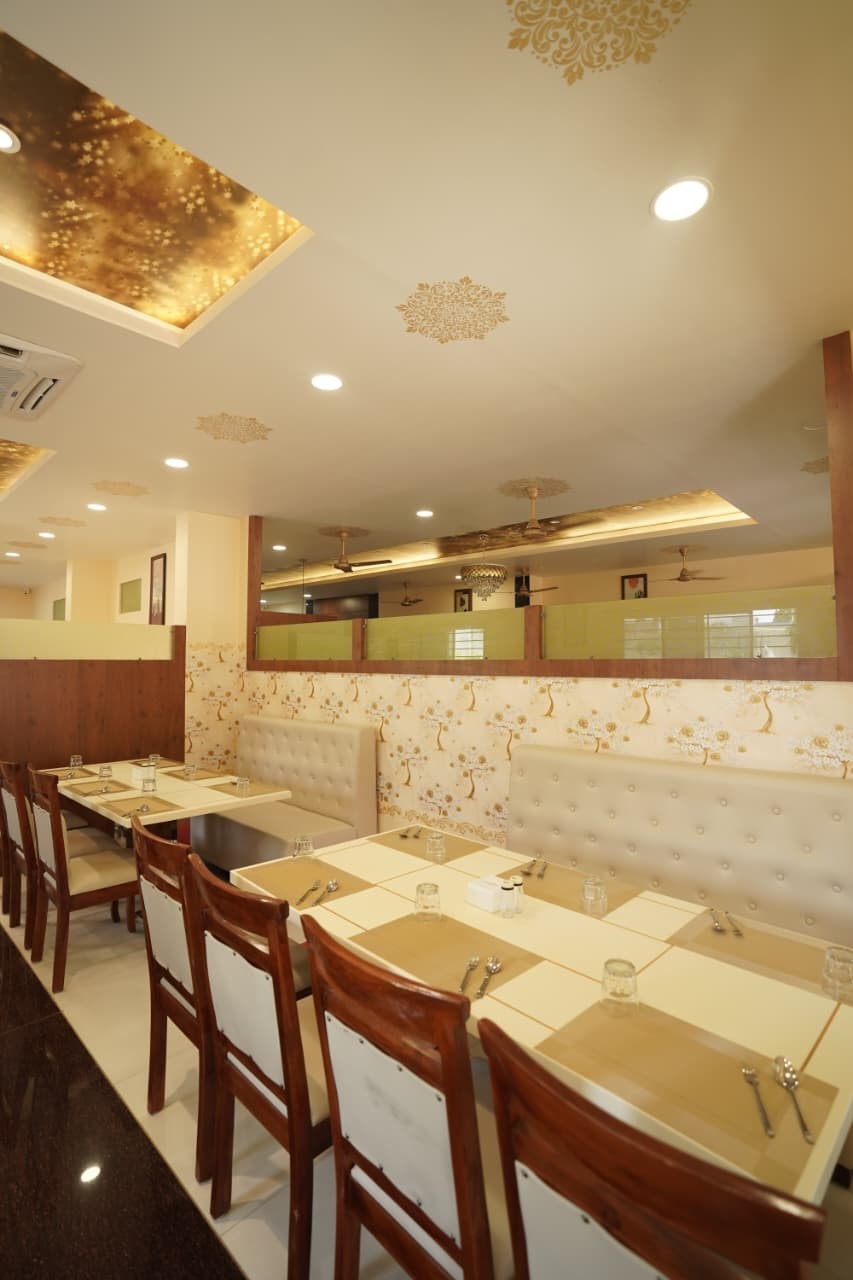 Booth seating under gold leaf ceiling panels