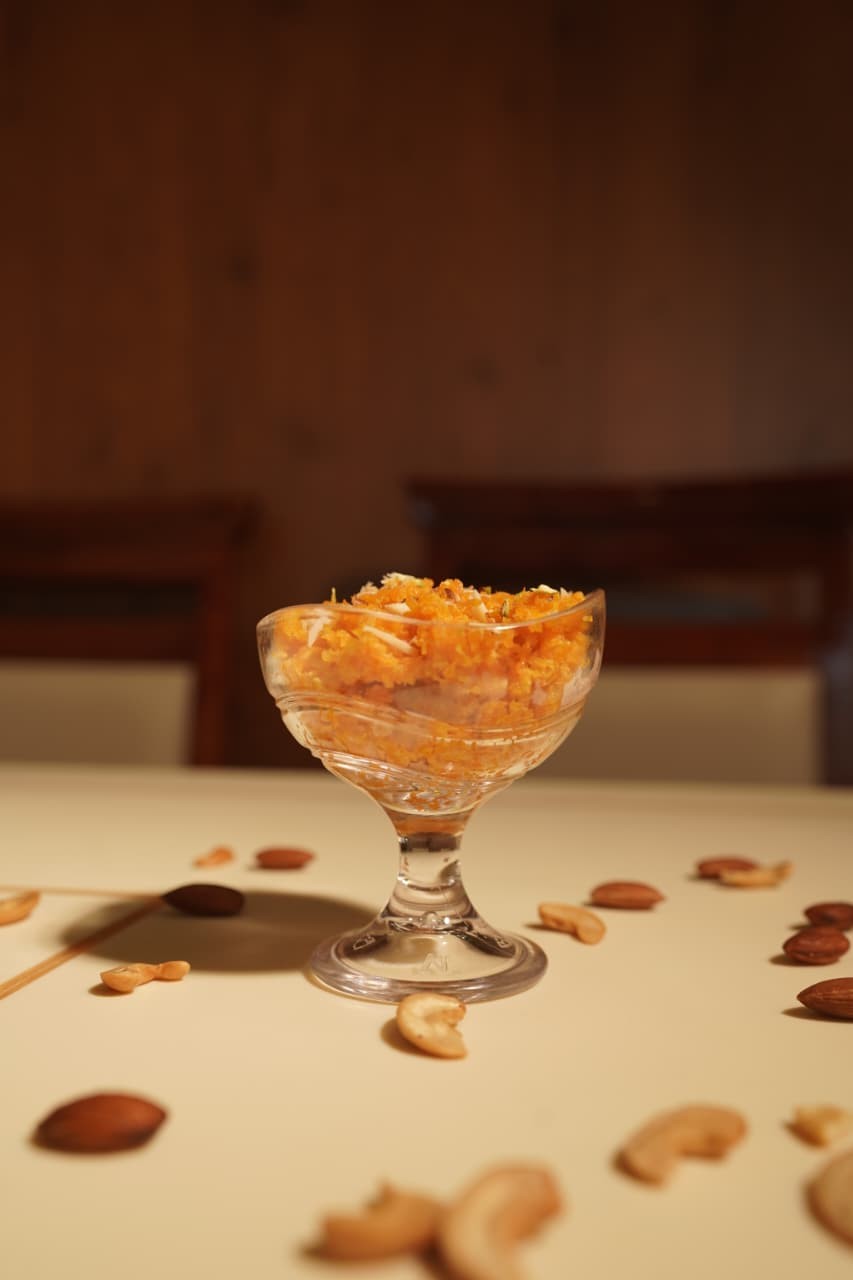Gajar halwa in a footed glass bowl