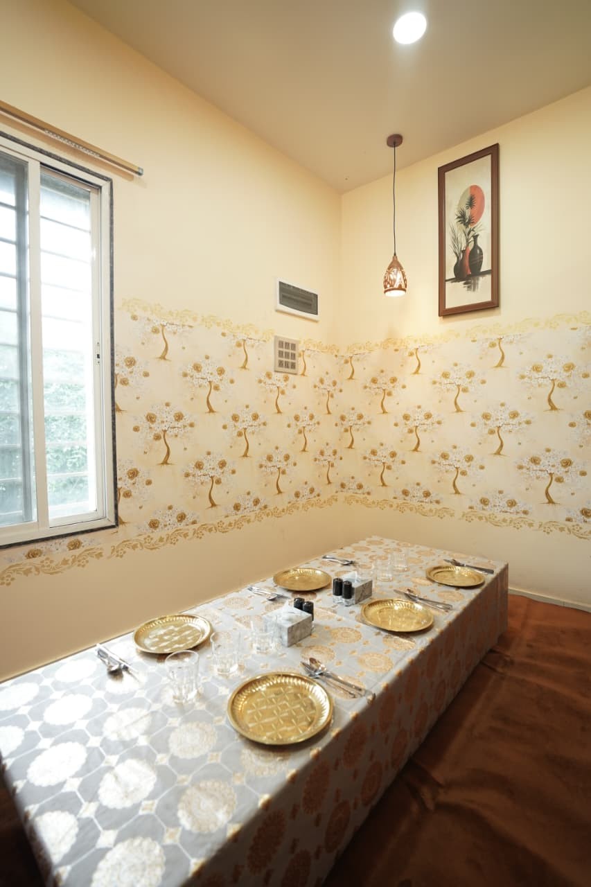 Private floor-seating room laid with brass plates