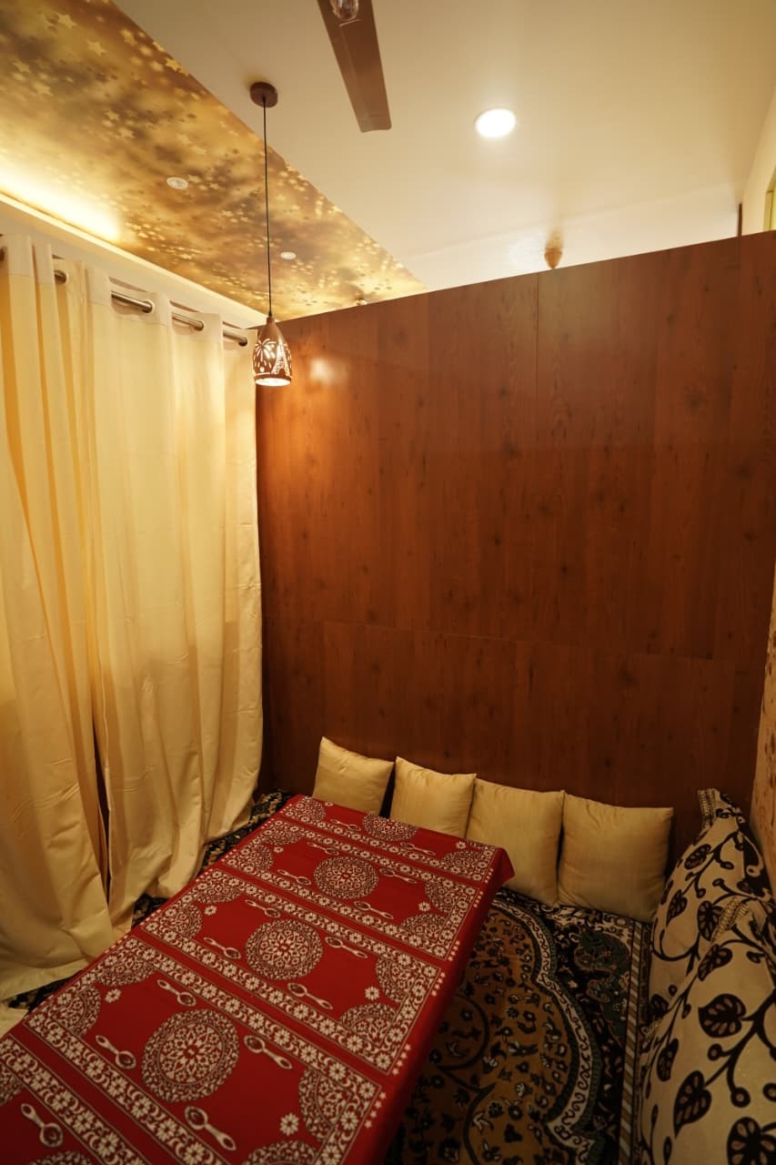 Majlis corner with a lantern pendant and walnut panelling
