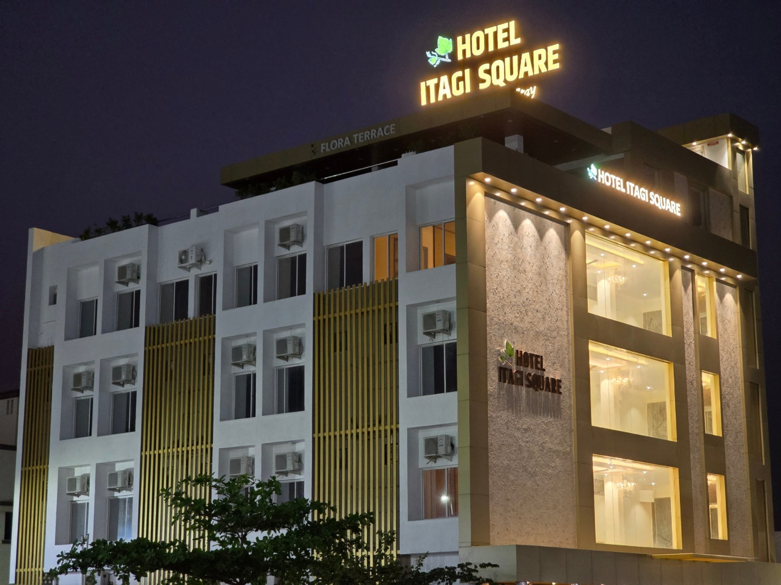 Hotel Itagi Square building lit up at night